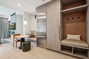 Mudroom with light wood-style flooring and recessed lighting