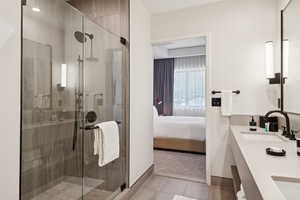 Ensuite bathroom with double vanity and a shower stall