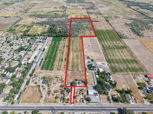 Aerial overview of property's location with property parcel outlined and rural landscape