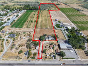 Aerial view of sparsely populated area featuring property parcel outlined