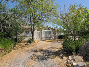 View of front facade featuring driveway