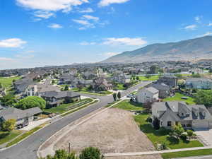 Aerial view of residential area featuring a mountainous background