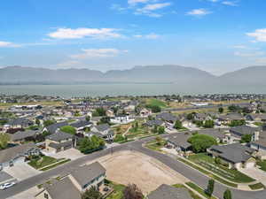 Aerial overview of property's location with nearby suburban area and mountains