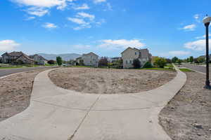 View of yard with a residential view and a mountain view