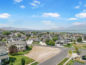 Aerial perspective of suburban area featuring a mountainous background
