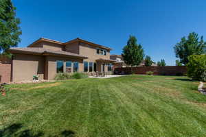 Back of house featuring stucco siding and a patio area