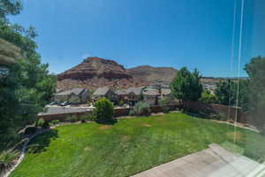 View of yard featuring a residential view and a mountain view