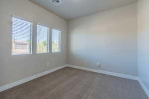 Unfurnished room featuring carpet flooring