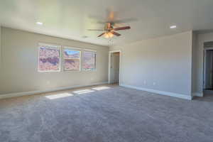 Carpeted empty room with recessed lighting and ceiling fan