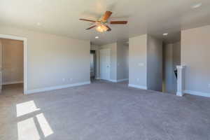 Carpeted empty room featuring recessed lighting and ceiling fan