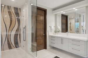 Full bath featuring vanity, a shower stall, and recessed lighting