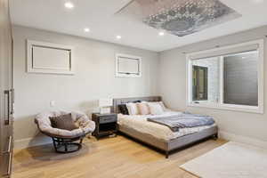 Bedroom with recessed lighting and light wood-style flooring
