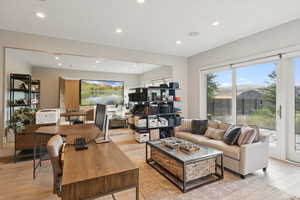 Living area featuring recessed lighting and light wood finished floors