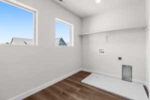Laundry room featuring washer hookup, dark wood finished floors, electric dryer hookup, and recessed lighting