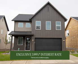View of front of house with board and batten siding, a shingled roof, and an attached garage