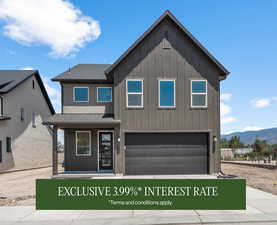 View of front of property featuring board and batten siding, an attached garage, driveway, and a shingled roof