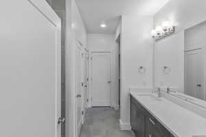 Bathroom with vanity and tile patterned flooring