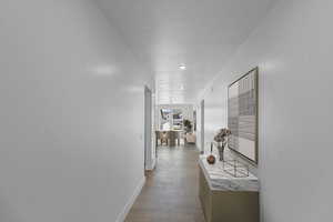 Hallway featuring light wood-style floors and recessed lighting
