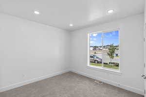 Bedroom 2 featuring carpet flooring and recessed lighting