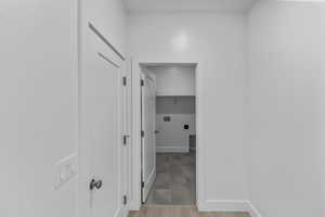 Hall featuring baseboards and light wood finished floors