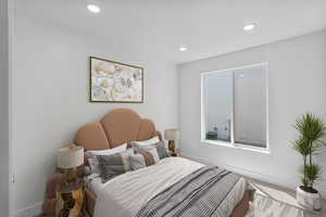 Bedroom 3 featuring carpet flooring and recessed lighting