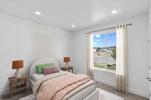 Bedroom 2 featuring carpet flooring and recessed lighting