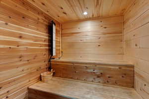 Relaxing sauna / steam room with wood walls and wooden ceiling
