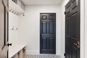 Mudroom featuring baseboards