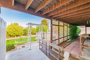 Fenced backyard with a patio area