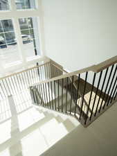 Staircase featuring plenty of natural light