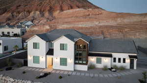 View of front facade featuring stucco siding and a mountain view