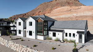 Modern inspired farmhouse with a mountain view and stucco siding