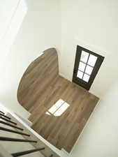 Detailed view of wood finished floors and arched walkways