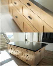 Kitchen with dark countertops, dark wood-style flooring, and a kitchen island