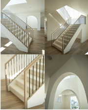 Stairway featuring wood finished floors and arched walkways