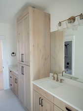 Bathroom with vanity and tub / shower combination