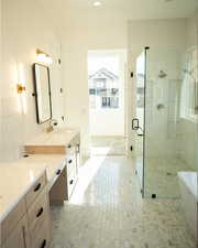 Bathroom with vanity, tiled shower, a freestanding bath, and recessed lighting