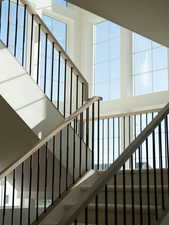 Stairs featuring a towering ceiling