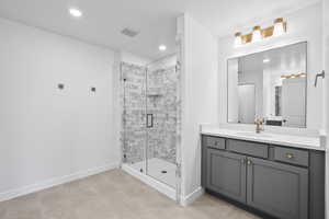 Primary full bathroom featuring vanity, a shower stall, recessed lighting, and tile patterned flooring