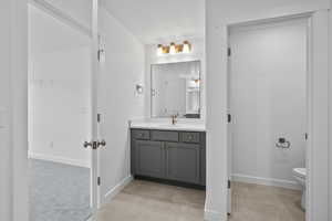 Bathroom featuring vanity and tile patterned flooring
