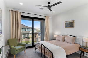 Carpeted bedroom featuring access to exterior, a ceiling fan, and recessed lighting