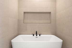 Full bath with a soaking tub