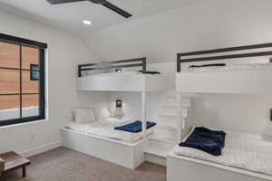 Bedroom featuring vaulted ceiling, carpet floors, recessed lighting, and ceiling fan