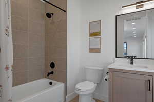 Full bathroom featuring vanity and shower / tub combo with curtain