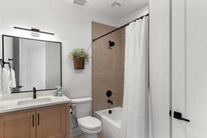 Bathroom featuring vanity and shower / tub combo