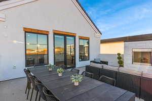 View of patio featuring outdoor dining area and an outdoor hangout area