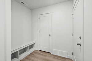 Mudroom featuring light wood-type flooring