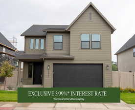 View of front of house featuring an attached garage and a shingled roof