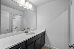 Bathroom with vanity and wood finished floors