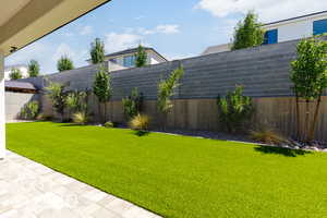 View of fenced backyard